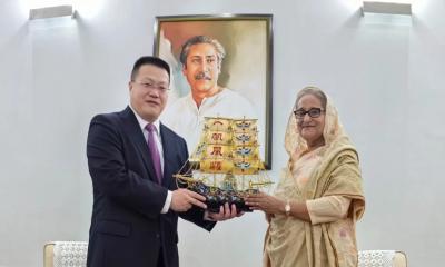 China congratulates PM Hasina, says committed to working with her