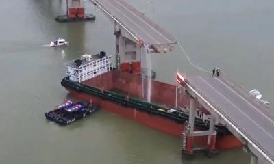 Ship rams bridge, plunging cars into river in China