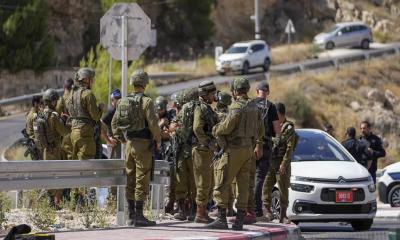 Palestinian gunman opens fire on a car in occupied West Bank