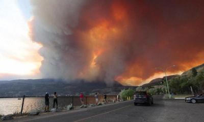 Western Canada wildfires force tens of thousands to flee