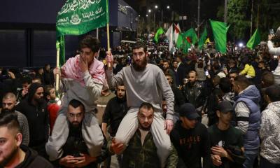 39 Palestinians released under hostage deal return home