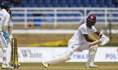 West Indies grind through turgid day against India