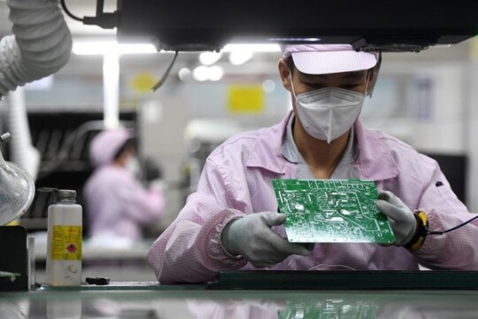 Asian factories take omicron risks in stride, for now