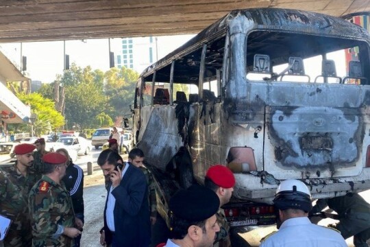 Blasts hit military bus in Damascus, at least 14 dead