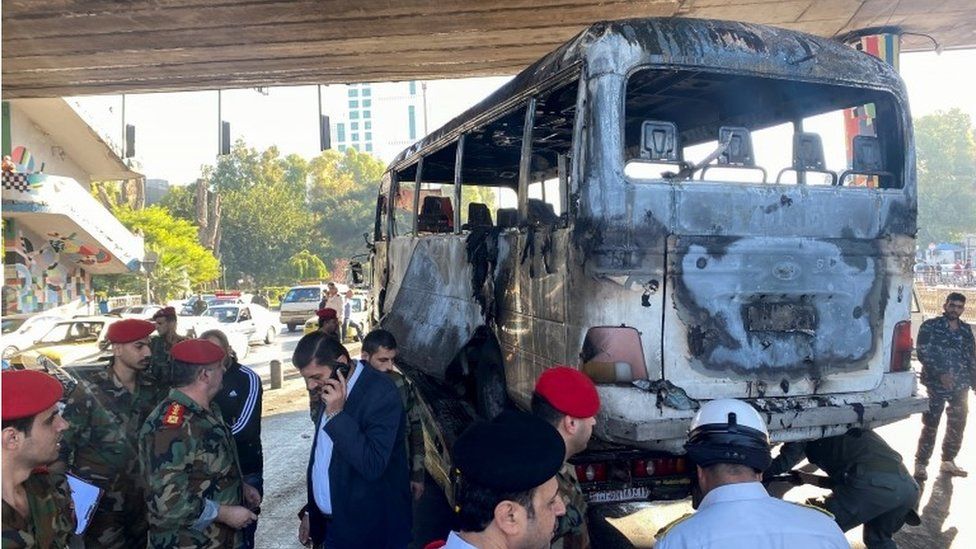 Blasts hit military bus in Damascus, at least 14 dead