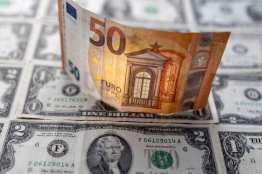 Euro drops to 20-year low, approaches parity with dollar