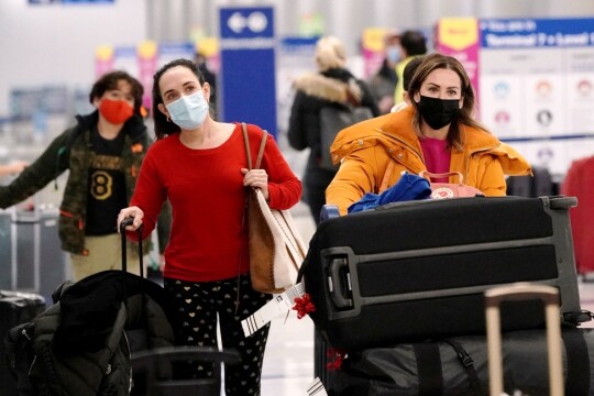 US airlines cancel more than 200 Christmas Eve flights amid Covid surge