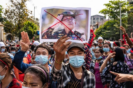 Myanmar protesters defy junta with strike, clapping protests on coup anniversary