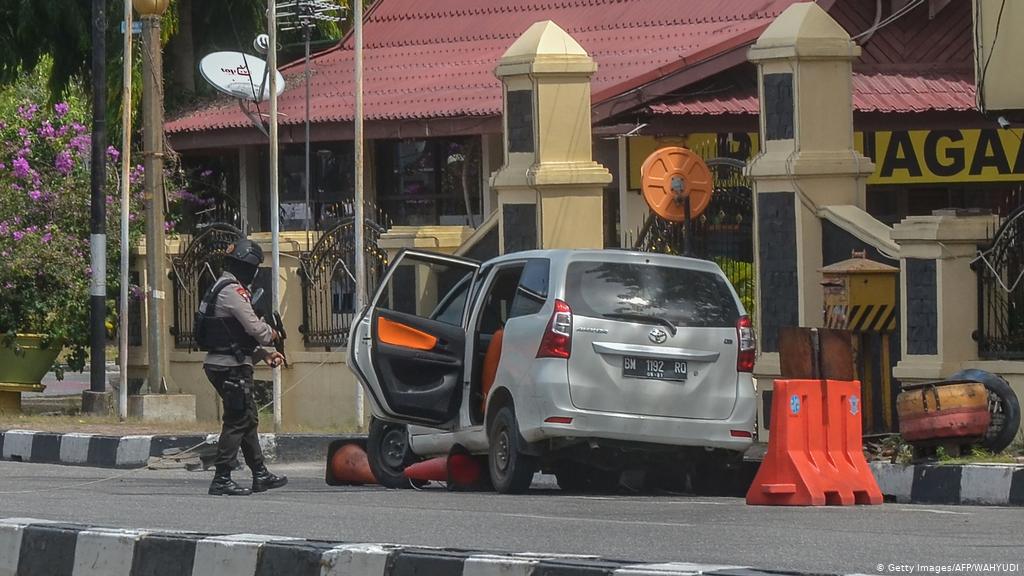 Police hunt suspects after four killed on Indonesian island