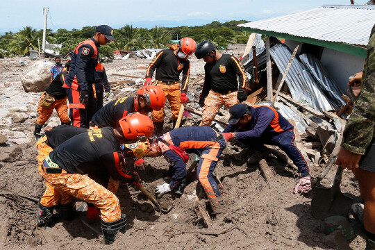 At least 100 dead, dozens missing as storm lashes Philippines