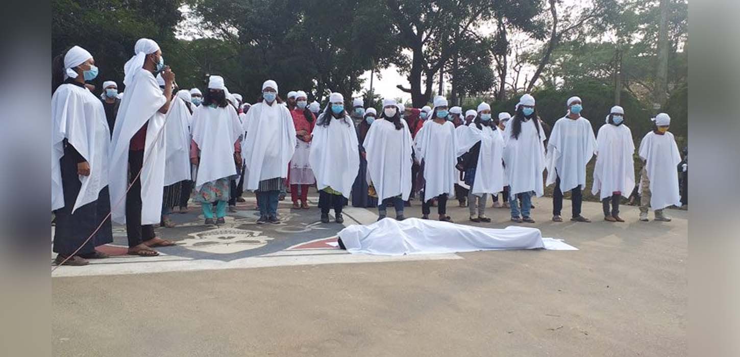 SUST protesters hold procession wearing shroud cloths